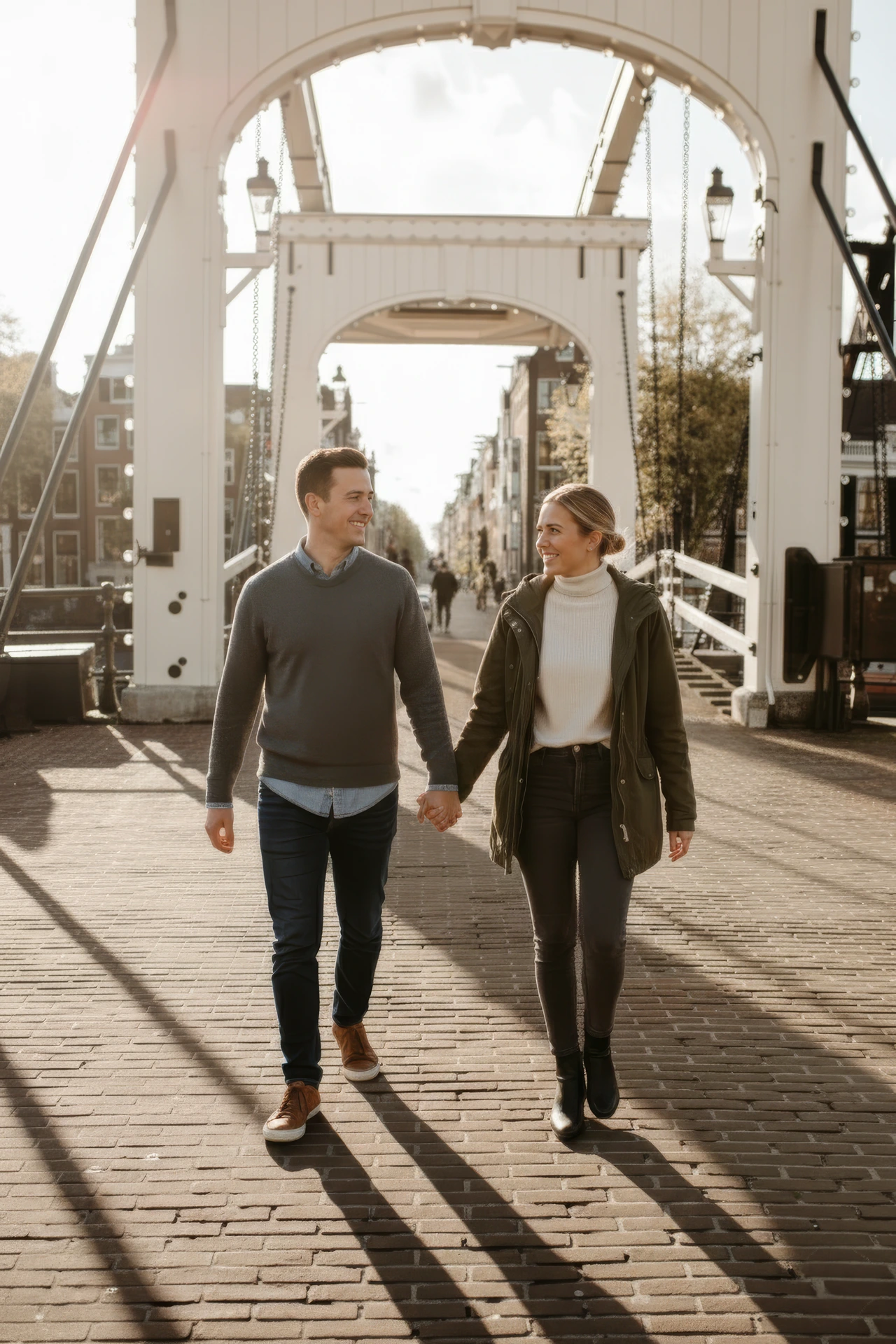 A couple riding on bicycles during a photoshoot in Amsterdam