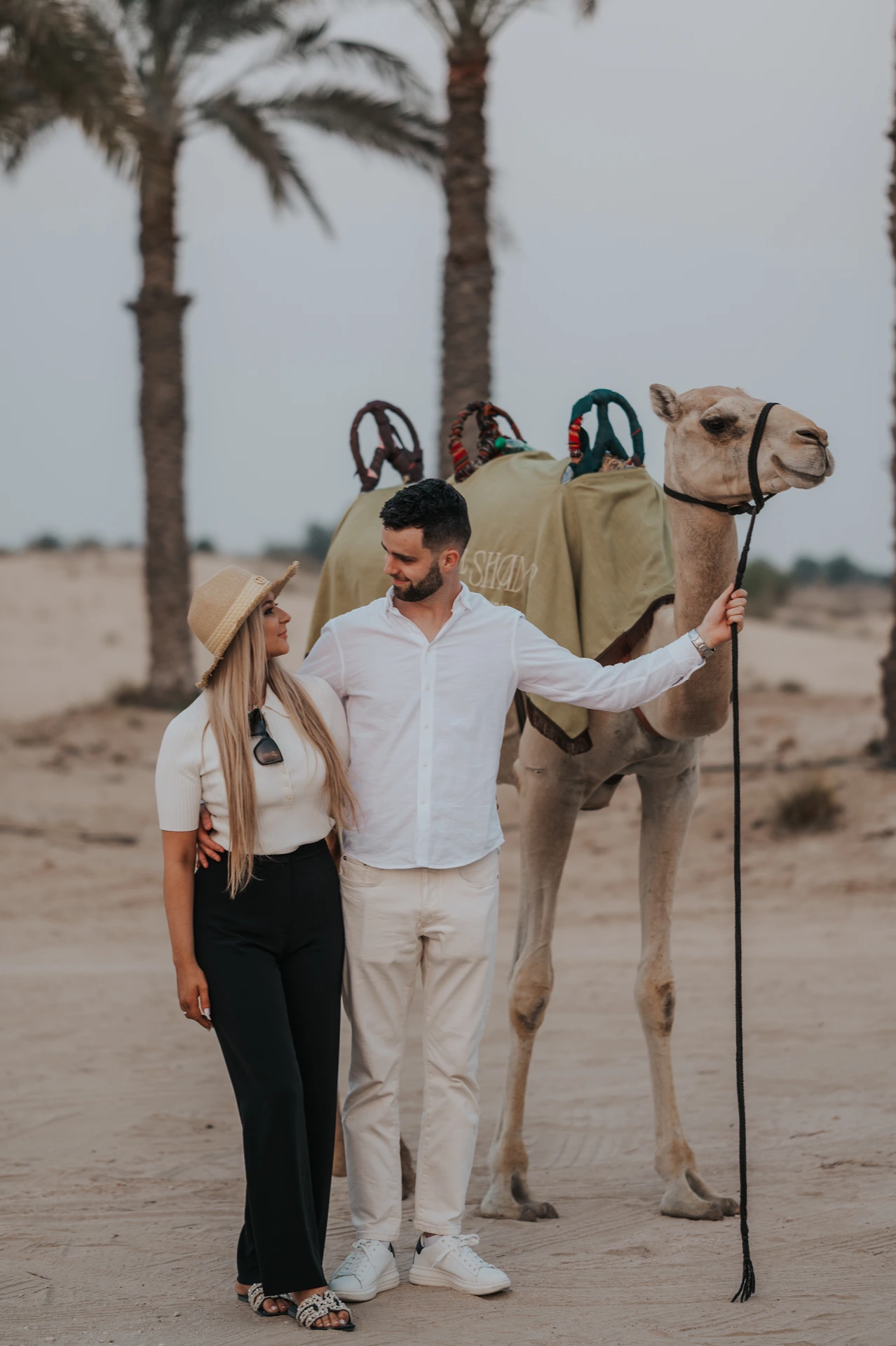 A photoshoot in Dubai for a couple with a camel